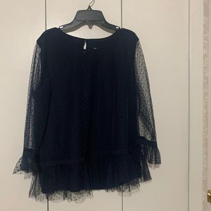 Dark long-sleeve polka dot top